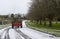 A maintenance tractor carrying wood debris to be composted at the local cemetary in Bangor county down Northern ireland