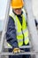 Maintenance worker man carrying aluminium ladder