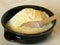 Maize flour, yellow, in bowl. Rustic stone ground.