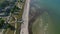 Majestic aerial drone view of travel destination tourist beach at Baltic sea in Scharbeutz, Germany, dolly in tilt down