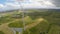 Majestic aerial view of beautiful green landscape with huge wind turbine farm