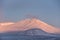 Majestic Alpen Glow hitting mountain peaks in Scottish Highlands during stunning Winter landscape sunrise