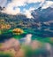 Majestic autumn view from flying drone of Eibsee lake with Zugspitze mountain range on background.