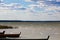 Majestic cloudscape and stationary boats at lakeside