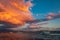 Majestic colorful cloud landscape over the sea and city at sunset. Izmir, Turkey