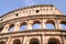 Majestic Colosseum in Rome against blue sky, Italy