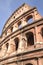 Majestic Colosseum in Rome against blue sky, Italy