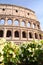 Majestic Colosseum in Rome against blue sky, Italy