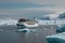 Majestic cruise ship in the Arctic surrounded by stunning glaciers and icebergs. Generative AI