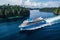 Majestic cruise ship sailing through captivating south seascape with paradise islands