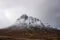 Majestic dramatic landscape Winter image of iconic Stob Dearg Buachaille Etive Mor mountain in Scottish Highlands