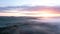 Majestic drone landscape image of sea of fog rolling across South Downs English countryside during Spring sunrise