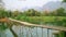 Majestic empty bamboo bridge, limestone mountains, vang vieng, laos