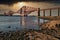 The majestic Forth Bridge captured in the sunlight prior to a storm.