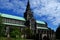 Majestic Glasgow Cathedral with green roof against the blue sky in Scotland