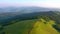 Majestic green hills from a bird`s eye view. Filmed in UHD 4k video