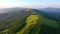 Majestic green hills from a bird`s eye view. Filmed in UHD 4k video