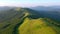 Majestic green hills from a bird`s eye view. Filmed in UHD 4k video