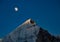 Majestic himalayan mountain Mt. bhagirathi sisters in moonlight in the evening. peak is lit by last light of sunset