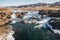 majestic icelandic landscape with hills and rapid river at sunny day,