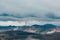 majestic icelandic landscape with mountains and steam from hot springs