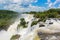 The majestic Iguazu Falls, on the background of blue sky