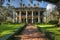 A majestic and imposing large house featuring a row of impressive columns on its front facade, A colonial mansion in a Southern