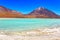 The majestic Laguna Verde or Green Lagoon in the altiplano of Bolivia with the Licancabur volcano in the background near the Salar