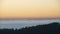 Majestic landscape image of cloud inversion at sunset over Dartmoor National Park in Engand with cloud rolling through forest on