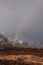 Majestic landscape image of vibrant rainbow in front of mountains in Scottish Highlands Rannoch Moor Stob Dearg