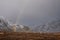 Majestic landscape image of vibrant rainbow in front of mountains in Scottish Highlands Rannoch Moor Stob Dearg