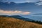 Majestic landscape of mountains at sunrise. View of the misty tops and layer hills of the mountains in the distance.