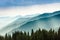 Majestic landscape of summer mountains. A view of the misty slopes of the mountains in the distance.