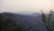 Majestic layered mountain ridges on a hazy day, featuring Bandarpoonch and Kala Nag glacial peaks. Stunning shot from Uttarakhand