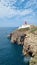 Majestic lighthouse atop a cliff overlooking the ocean, Sagres