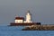 Majestic lighthouse standing tall against a bright blue sky