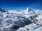 Majestic Matterhorn mountain in front of a blue sky with clouds