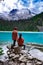 Majestic mountain lake in Canada. Upper Joffre Lake Trail View, couple visit Joffre Lakes Provincial Park - Middle Lake