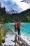 Majestic mountain lake in Canada. Upper Joffre Lake Trail View, couple visit Joffre Lakes Provincial Park - Middle Lake