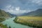 Majestic mountain landscape on a rainy summer or autumn day. Beautiful view of the bend of Katun river, plains and rocks. Torrents