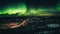 Majestic mountain peak illuminated by aurora polaris generated by AI