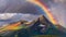 A majestic mountain peak piercing the clouds, with a vibrant rainbow arcing over its summit after a refreshing rainfall.