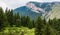 Majestic mountain peak and sloping hillside covered with lush forest near Bozeman, Montana