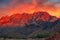 majestic mountain range standing guard over fiery canyon sunset