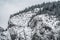 Majestic mountains in winter with white snowy spruces. Wonderful wintry landscape. Amazing view on snowcovered rock mountains.