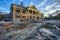 Majestic New Residential House Construction Site with Blue Sky at Sunset, Incomplete Building with Scaffolding