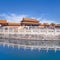 Majestic pavilion reflected in canal, Palace Museum, Beijing, China