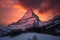 majestic peak, covered in snow and surrounded by the warm colors of sunset
