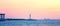 Majestic pink sunset with ocean and lighthouse, Qingdao, Shandong Province, China