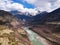 A majestic river winding through a picturesque mountain valley: Namcha Barwa, Linzhi, Tibet, China.